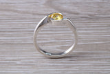 Simple and very elegant real Yellow Sapphire look ring, sterling silver set with half carat Sapphire C Z, very smooth rub over setting