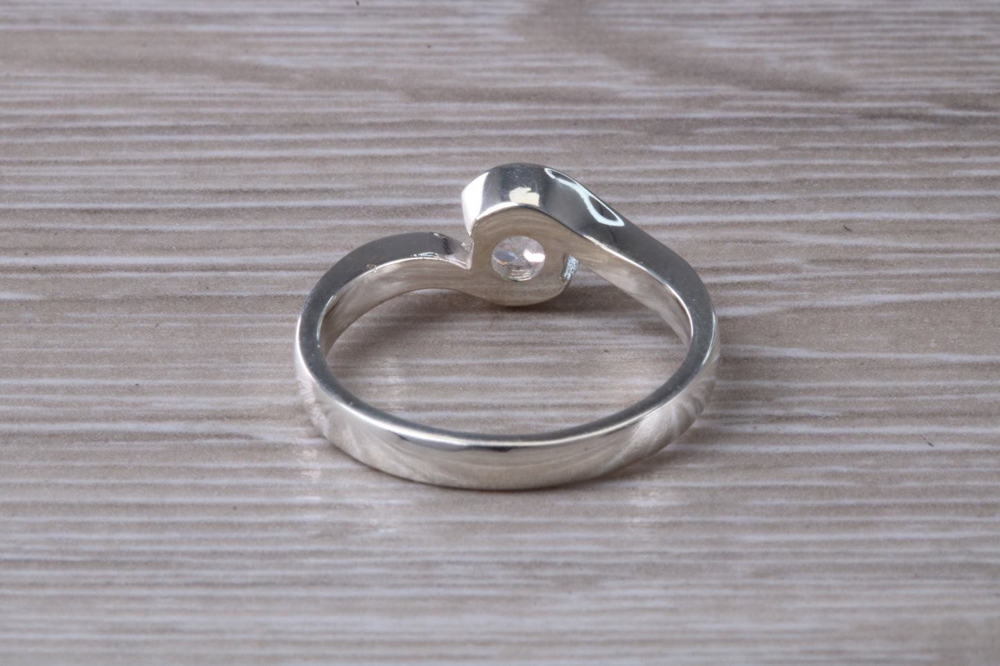 Simple and very elegant real Diamond look ring, sterling silver set with half carat diamond look C Z, very smooth rub over setting