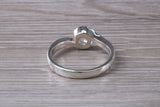Simple and very elegant real Diamond look ring, sterling silver set with half carat diamond look C Z, very smooth rub over setting