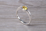 Simple and very elegant real Yellow Sapphire look ring, sterling silver set with half carat Sapphire C Z, very smooth rub over setting