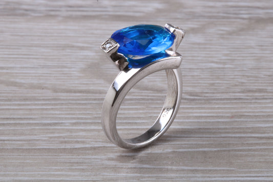 Elegant real Blue Sapphire look ring, sterling silver set with Oval cut Sapphire C Z, very unusual design