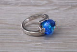 Elegant real Blue Sapphire look ring, sterling silver set with Oval cut Sapphire C Z, very unusual design