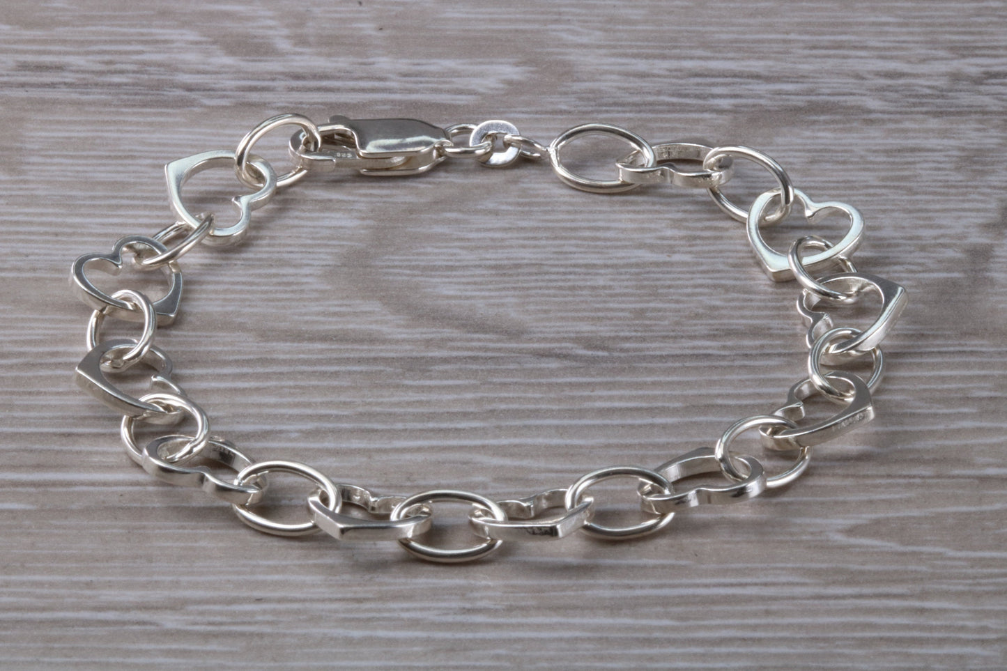 Silver open linked Bracelet with oval and heart shaped links, light weight and suitable for age groups