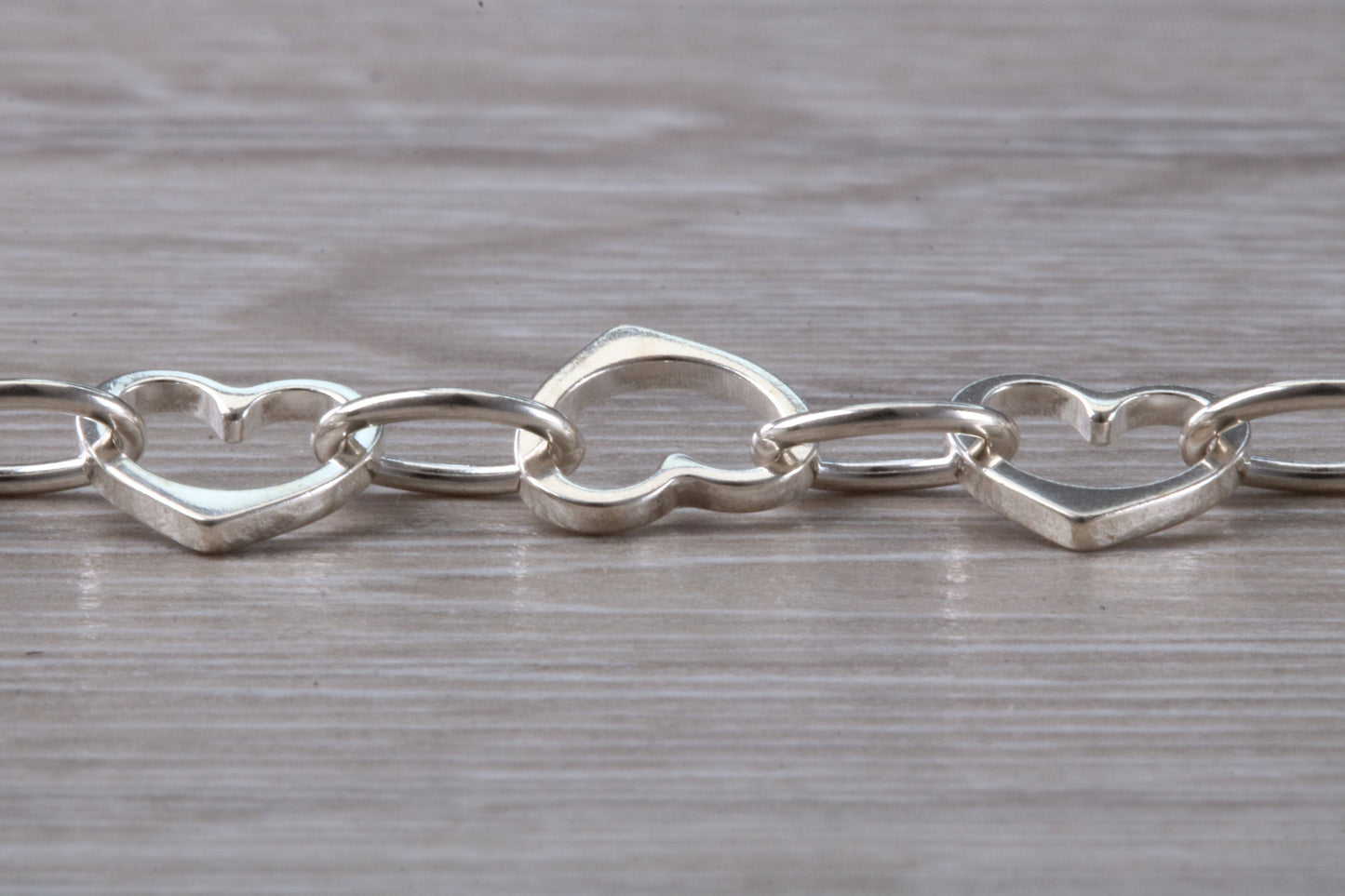 Silver open linked Bracelet with oval and heart shaped links, light weight and suitable for age groups