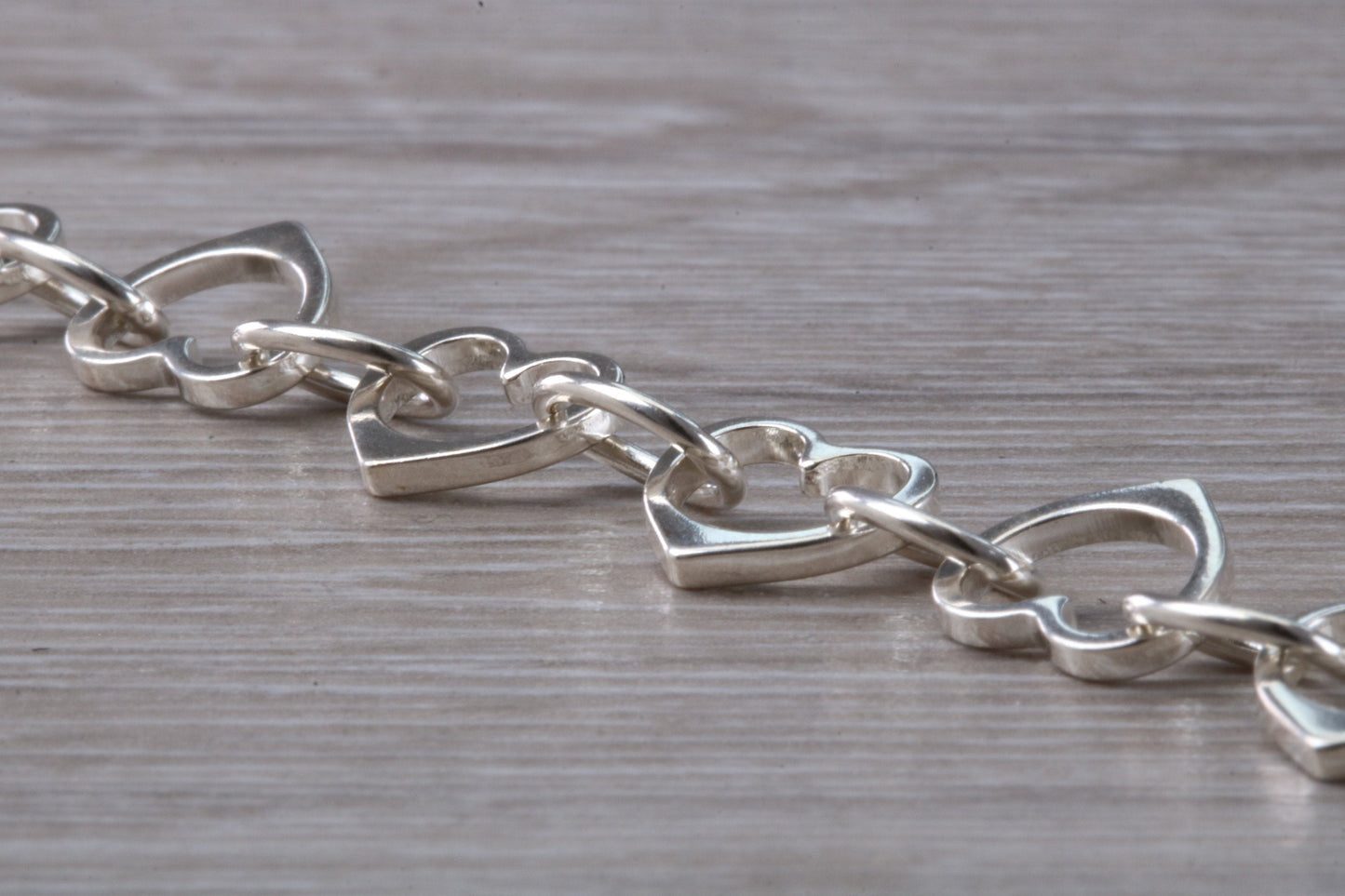 Silver open linked Bracelet with oval and heart shaped links, light weight and suitable for age groups