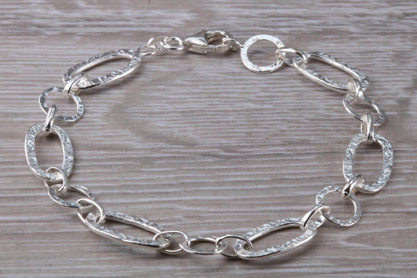 Silver open linked Bracelet with oval and round shaped hammered effect links, light weight and suitable for age groups