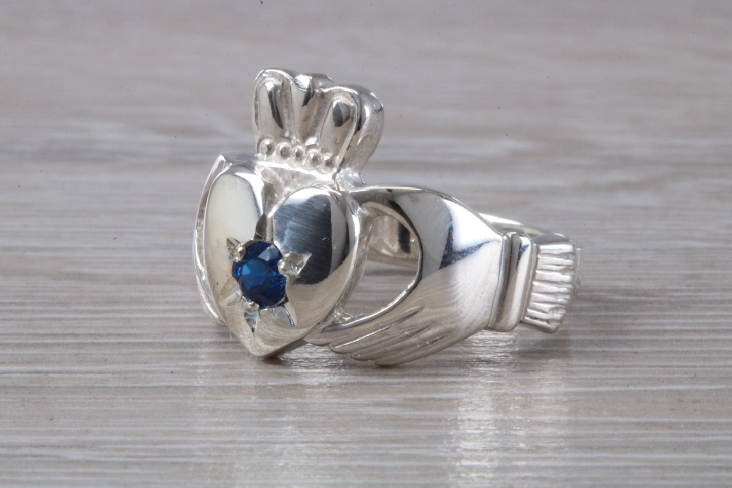 Very large and very heavy stone set Claddagh ring, set with Sapphire Blue C Z, solid silver, suitable for ladies or gents