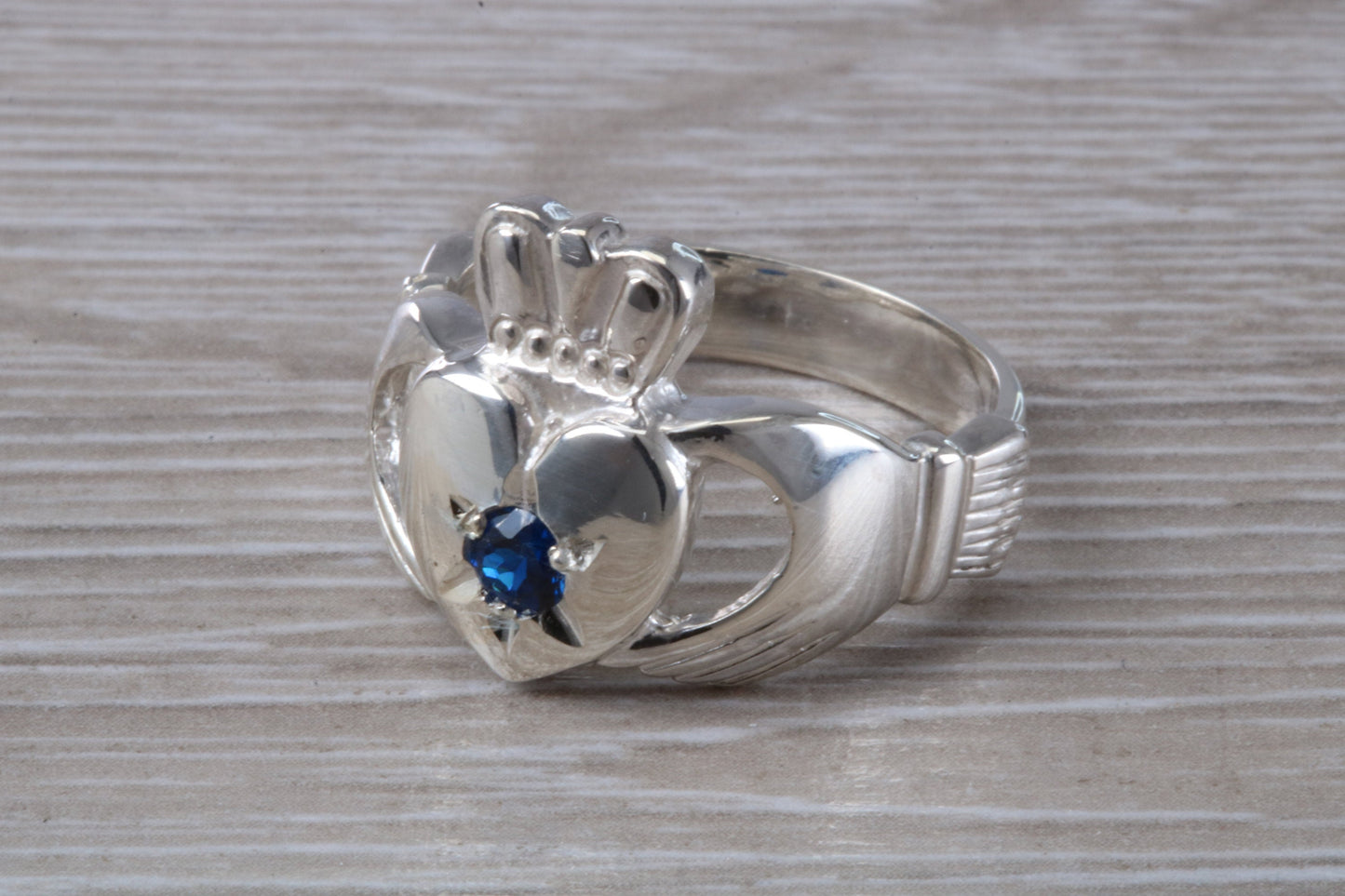 Very large and very heavy stone set Claddagh ring, set with Sapphire Blue C Z, solid silver, suitable for ladies or gents