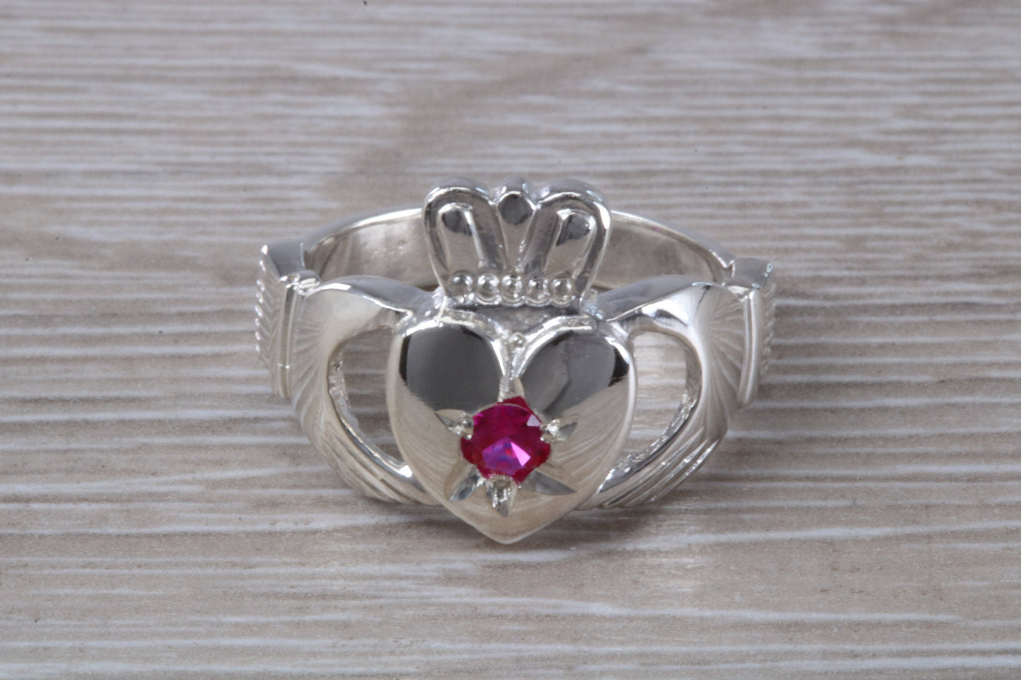 Very large and very heavy stone set Claddagh ring, set with Ruby Red C Z, solid silver, suitable for ladies or gents