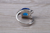 Elegant real Blue Sapphire look ring, sterling silver set with Oval cut Sapphire C Z, very unusual design