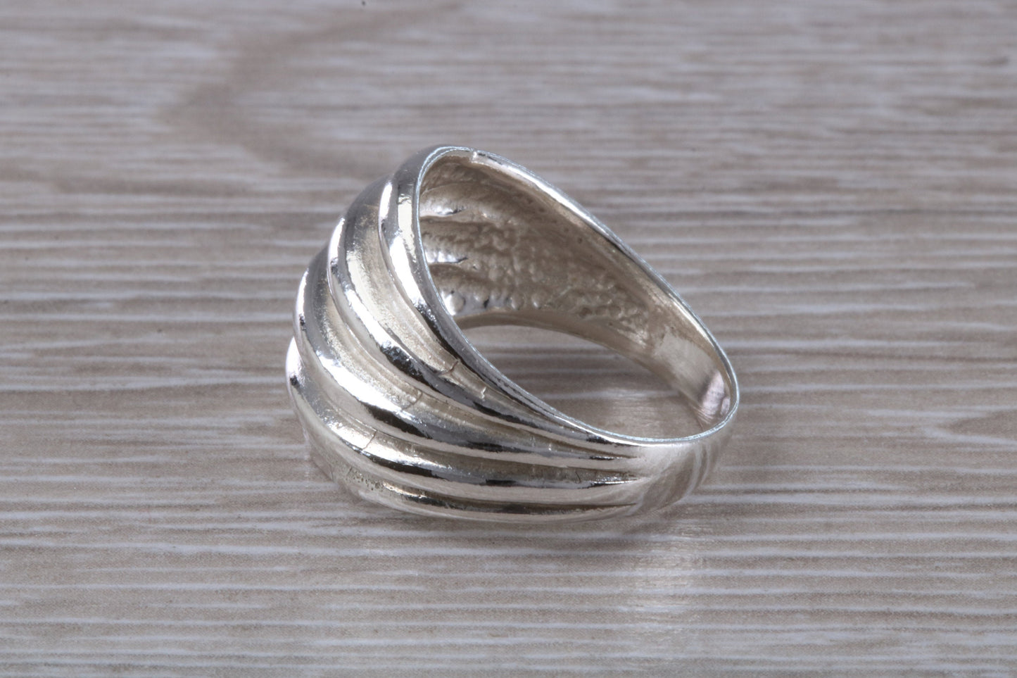 Abstract ring, solid silver with high polished finish, suitable for all ages. Available in silver, yellow gold, white gold and platinum