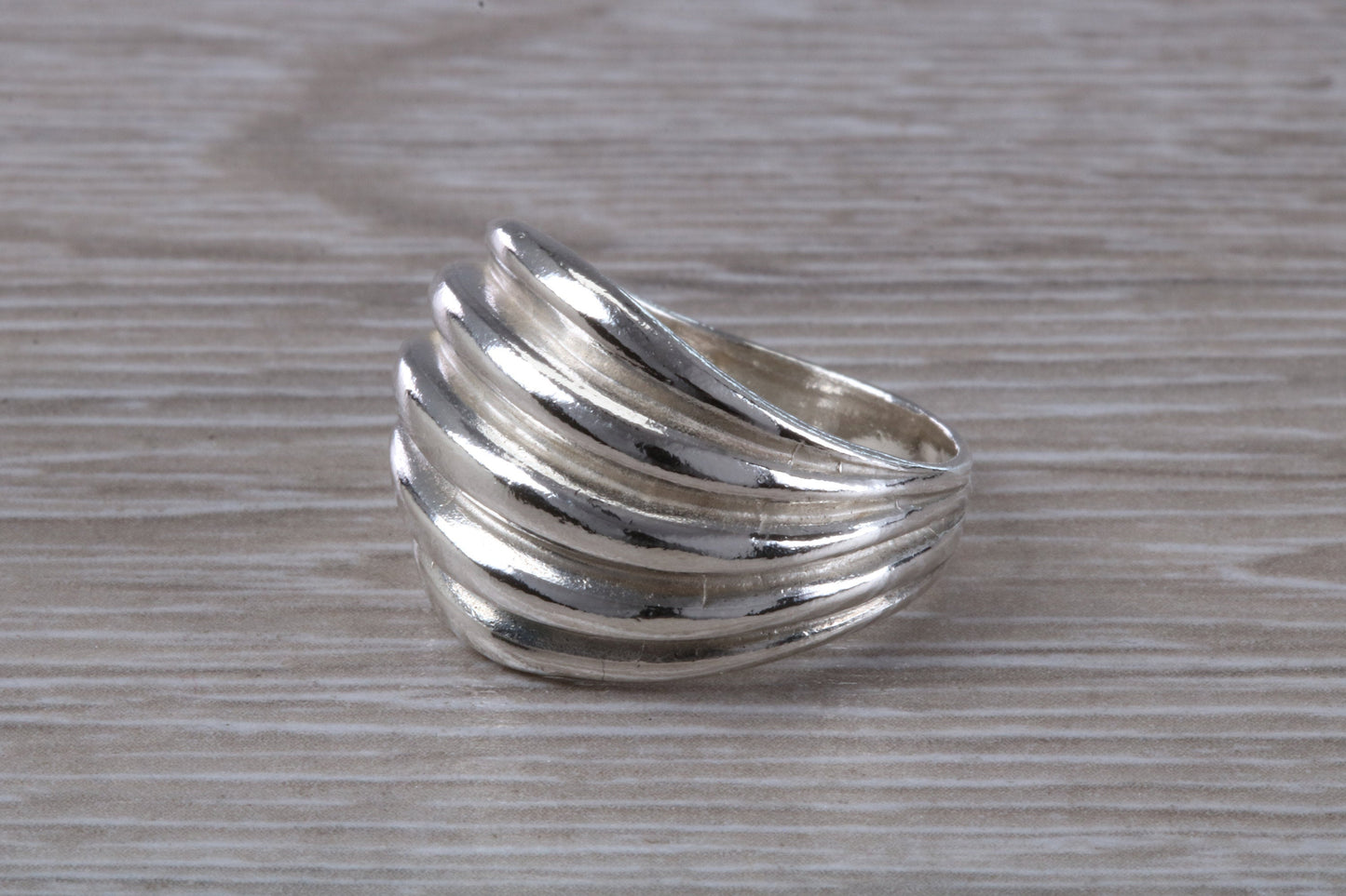 Abstract ring, solid silver with high polished finish, suitable for all ages. Available in silver, yellow gold, white gold and platinum