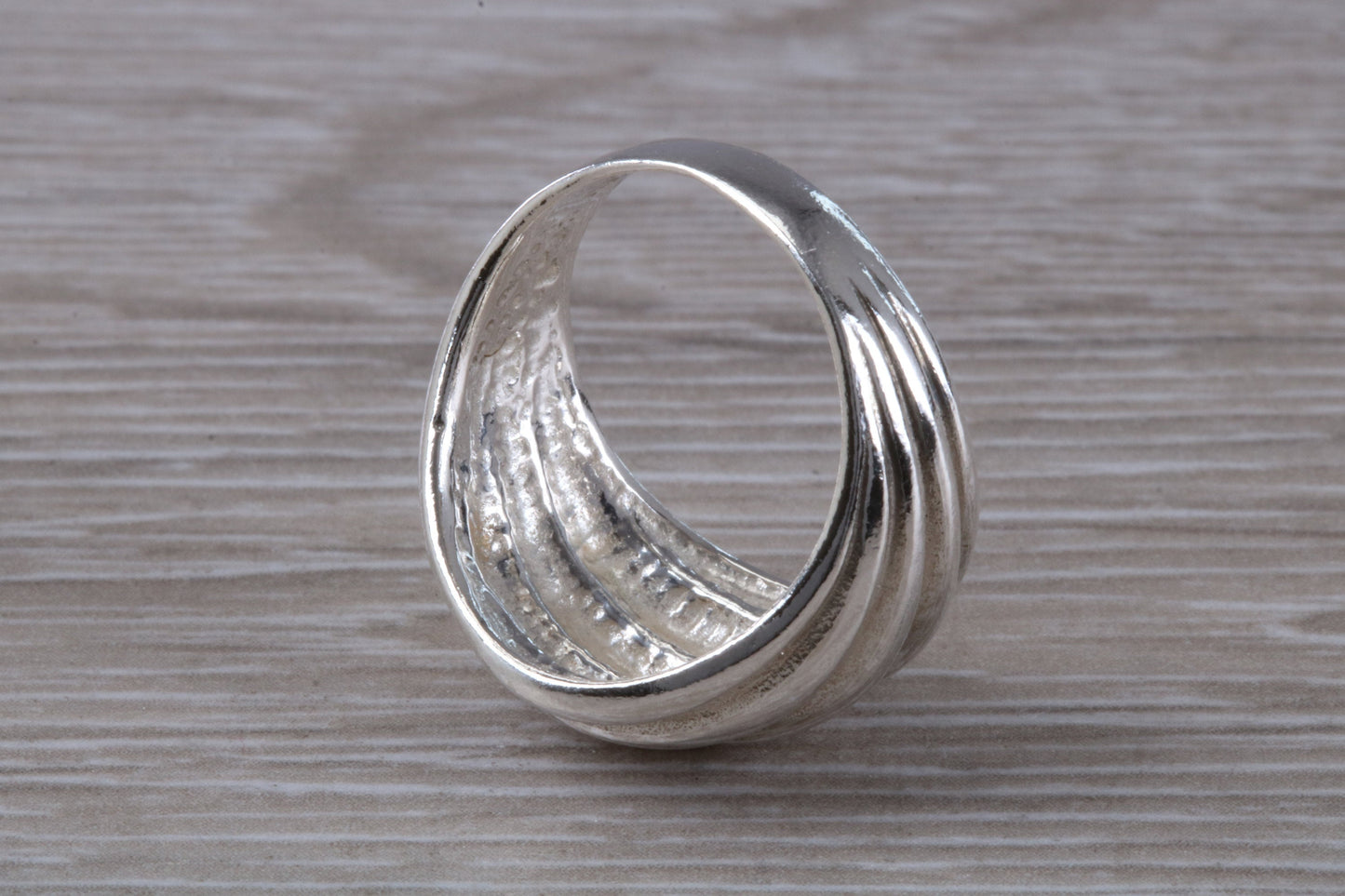 Abstract ring, solid silver with high polished finish, suitable for all ages. Available in silver, yellow gold, white gold and platinum