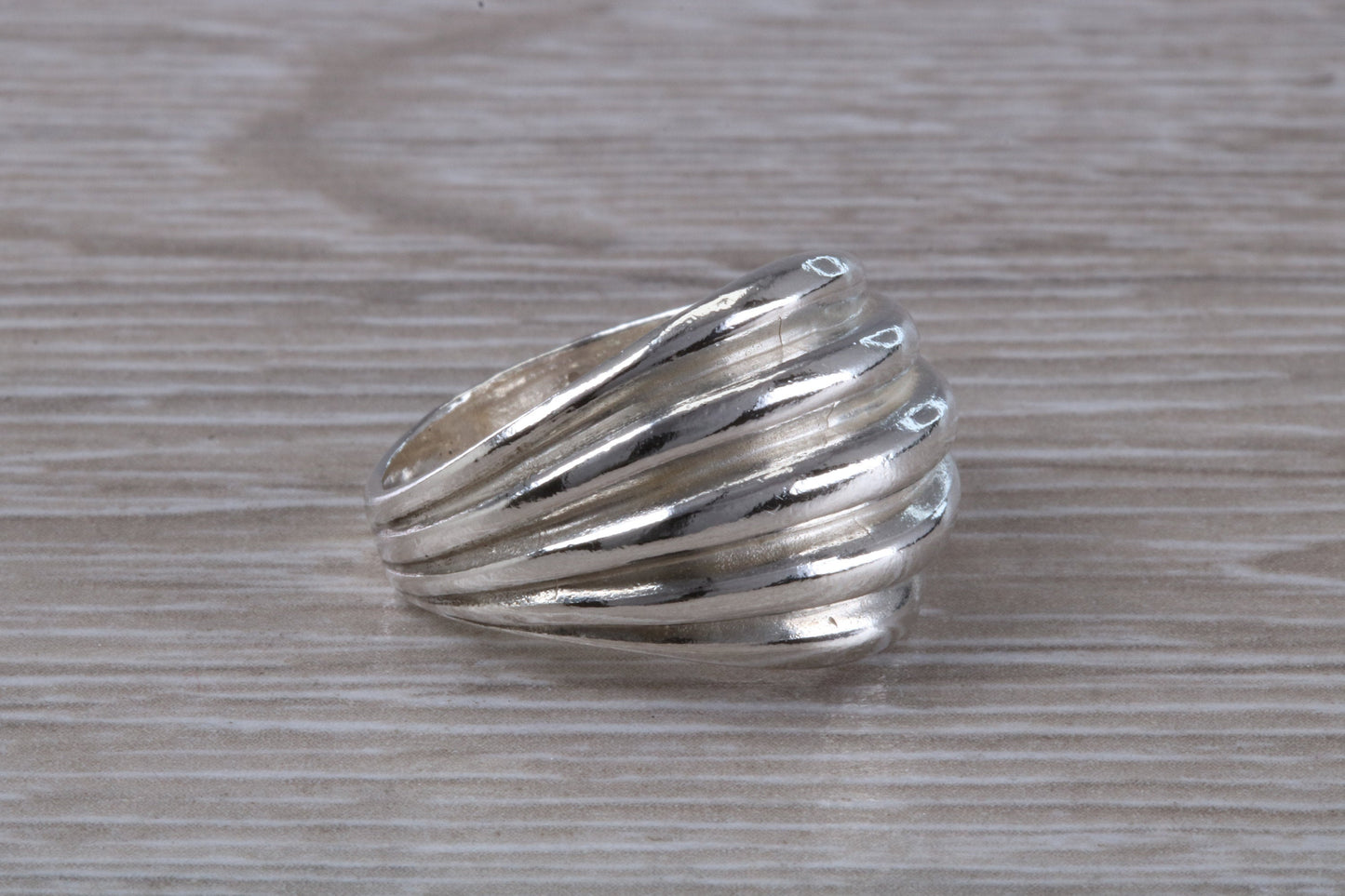 Abstract ring, solid silver with high polished finish, suitable for all ages. Available in silver, yellow gold, white gold and platinum