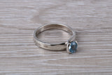 Simple and very elegant real Aquamarine look ring, sterling silver set with half carat Aquamarine C Z, very smooth rub over setting