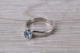 Simple and very elegant real Aquamarine look ring, sterling silver set with half carat Aquamarine C Z, very smooth rub over setting