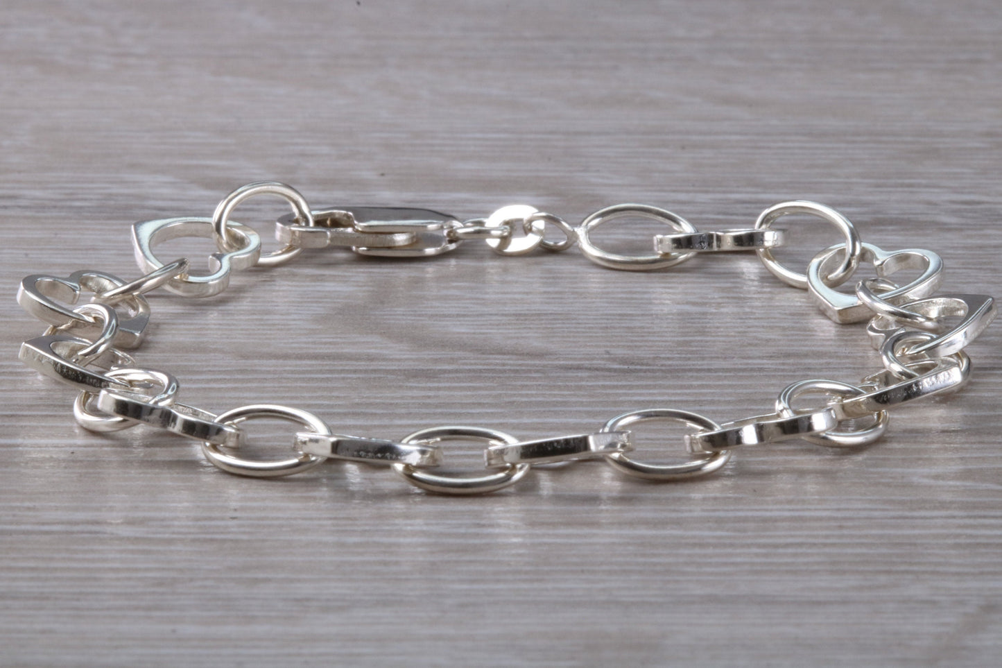Silver open linked Bracelet with oval and heart shaped links, light weight and suitable for age groups