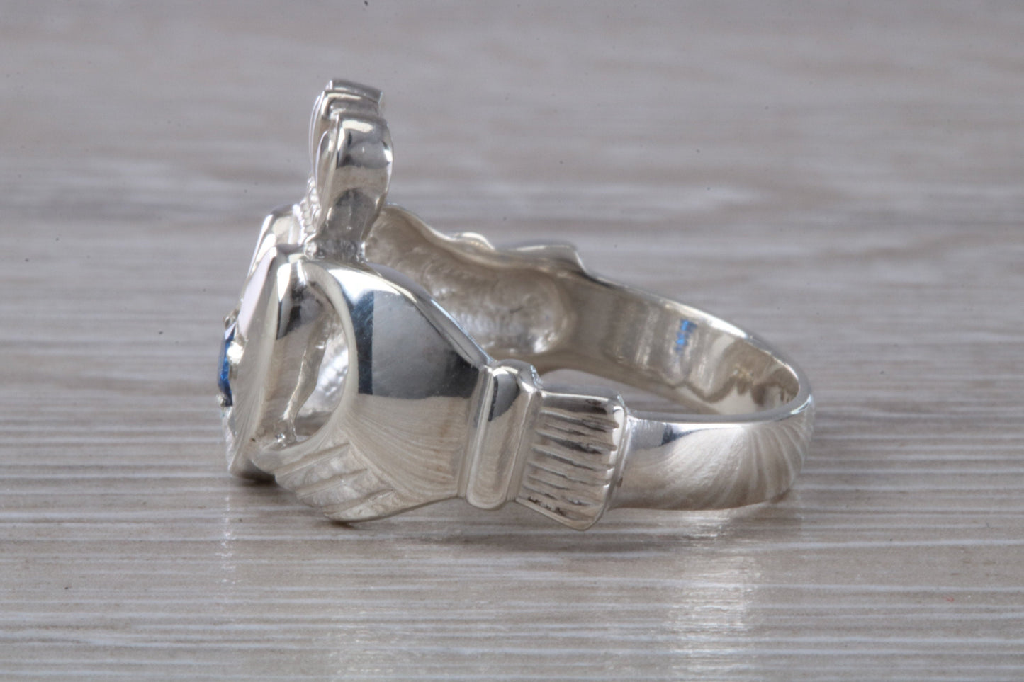 Very large and very heavy stone set Claddagh ring, set with Sapphire Blue C Z, solid silver, suitable for ladies or gents