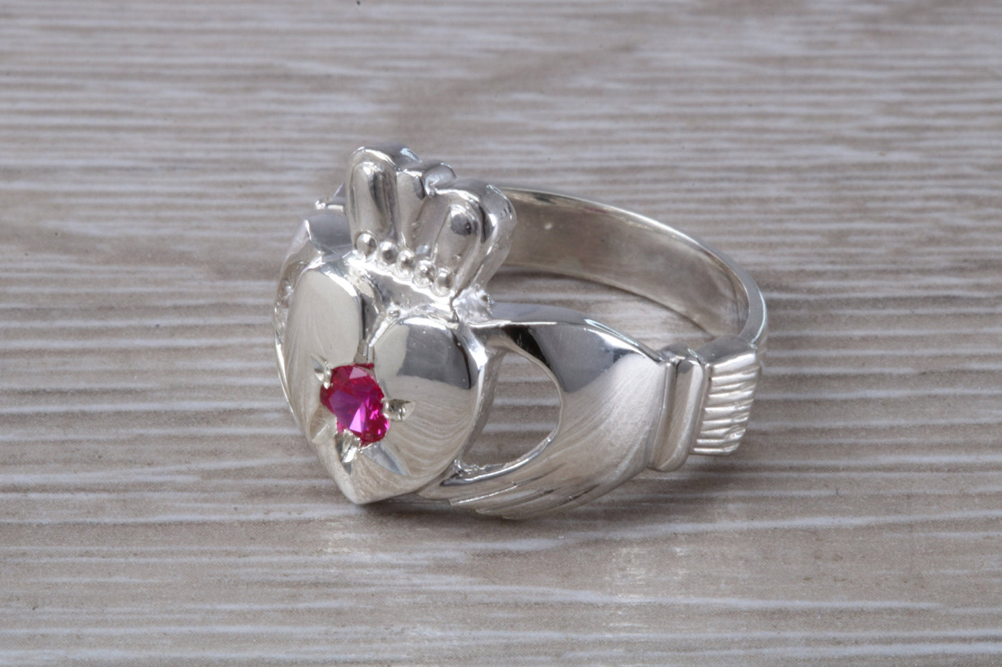 Very large and very heavy stone set Claddagh ring, set with Ruby Red C Z, solid silver, suitable for ladies or gents