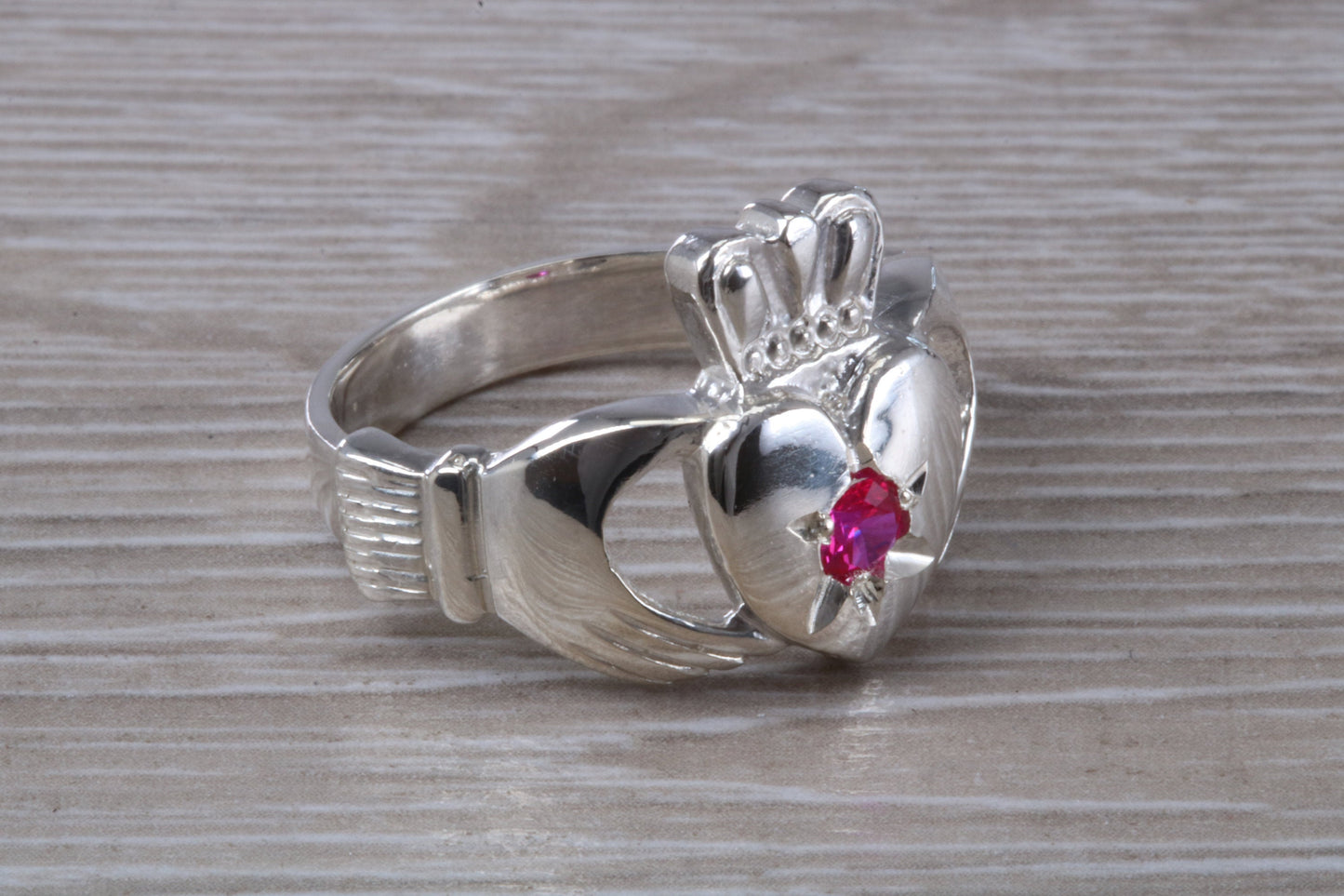 Very large and very heavy stone set Claddagh ring, set with Ruby Red C Z, solid silver, suitable for ladies or gents