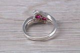Ruby ring, crossover styled, sterling silver set with two round cut Ruby Cubic Zirconia, Ideal promise, dress engagement ring