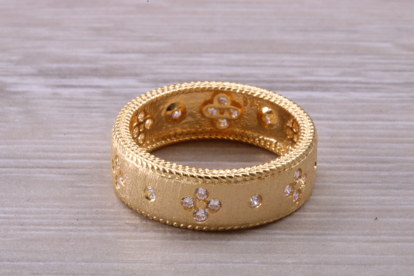 Sterling Silver 7 mm wide band, 18ct Yellow Gold plated and set with Diamond White C Z