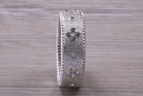 Sterling Silver Gold 7 mm wide band, Rhodium plated and set with Diamond White C Z