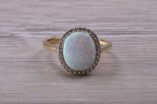 Opal and Diamond White Cubic Zirconia set ring, solid 9ct Yellow Gold, very fiery oval cut Cultured Opal