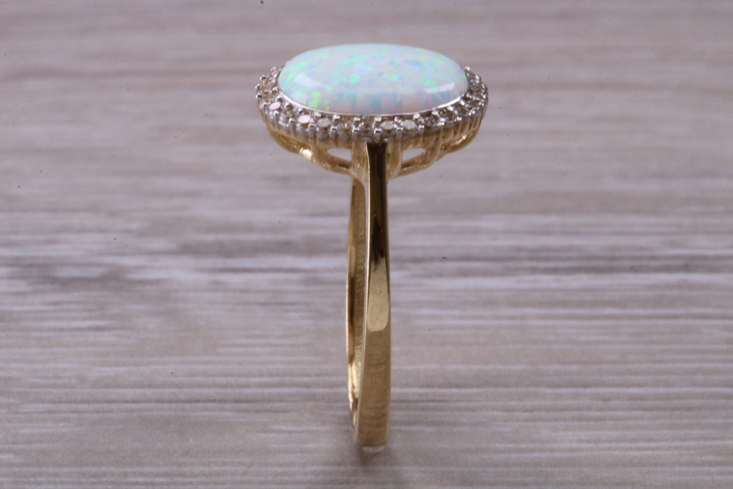 Opal and Diamond White Cubic Zirconia set ring, solid 9ct Yellow Gold, very fiery oval cut Cultured Opal