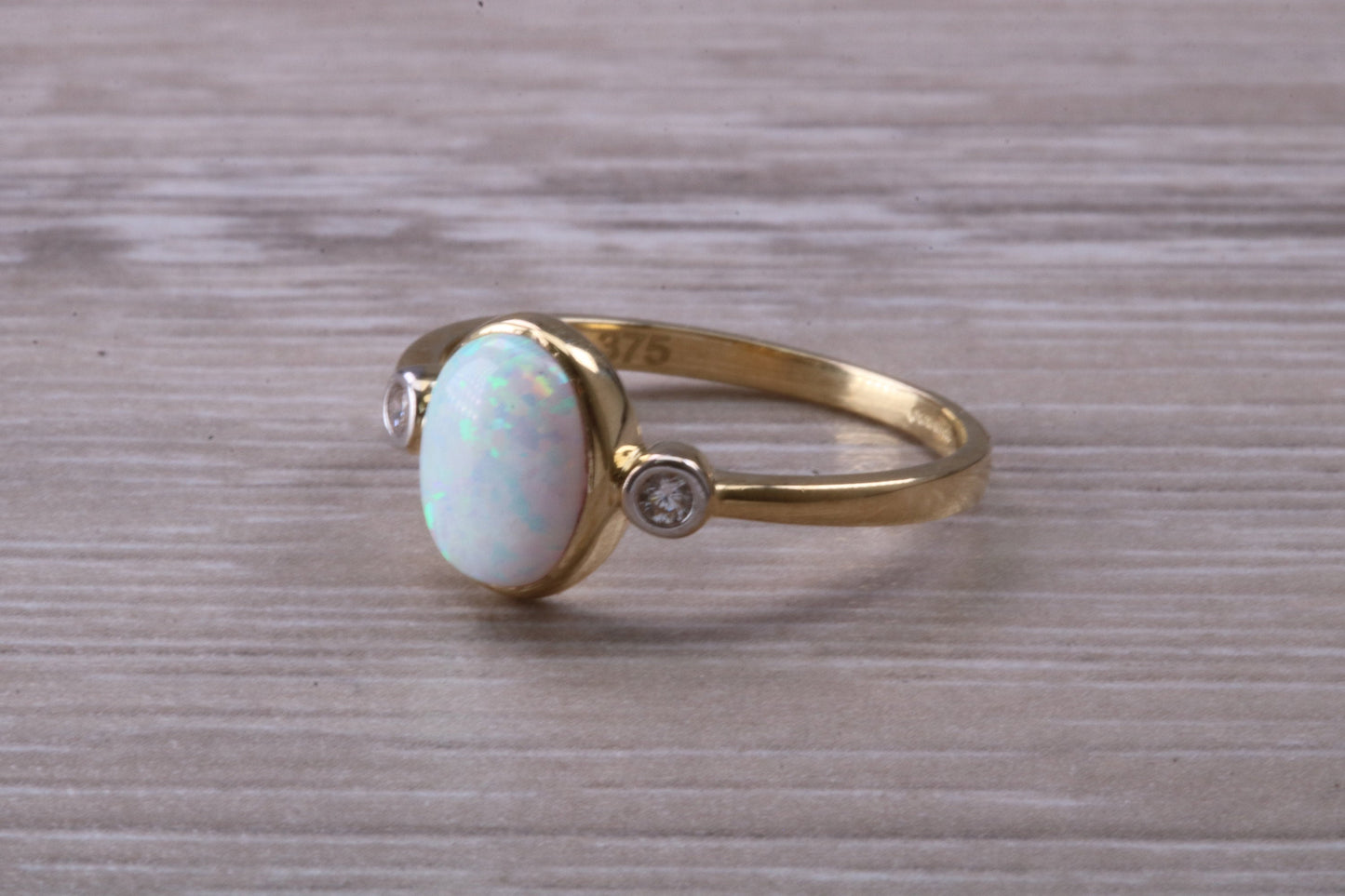 Opal and Diamond White Cubic Zirconia set Trilogy ring, solid 9ct Yellow Gold, very fiery oval cut Cultured Opal