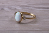 Opal and Diamond White Cubic Zirconia set Trilogy ring, solid 9ct Yellow Gold, very fiery oval cut Cultured Opal
