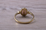 Opal and Diamond White Cubic Zirconia set Trilogy ring, solid 9ct Yellow Gold, very fiery oval cut Cultured Opal