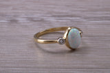 Opal and Diamond White Cubic Zirconia set Trilogy ring, solid 9ct Yellow Gold, very fiery oval cut Cultured Opal
