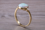 Opal and Diamond White Cubic Zirconia set Trilogy ring, solid 9ct Yellow Gold, very fiery oval cut Cultured Opal