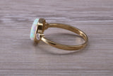 Opal and Diamond White Cubic Zirconia set Trilogy ring, solid 9ct Yellow Gold, very fiery oval cut Cultured Opal