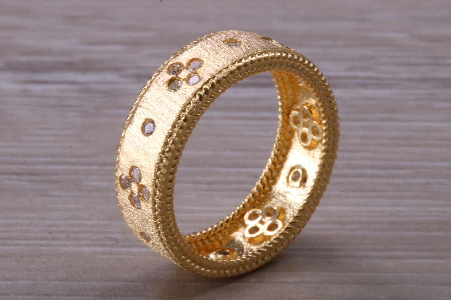 Sterling Silver 7 mm wide band, 18ct Yellow Gold plated and set with Diamond White C Z