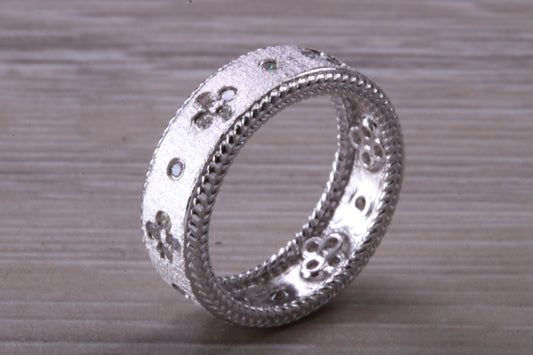 Sterling Silver Gold 7 mm wide band, Rhodium plated and set with Diamond White C Z