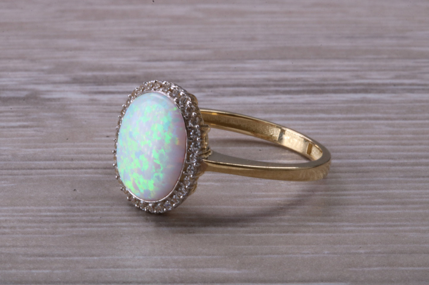 Opal and Diamond White Cubic Zirconia set ring, solid 9ct Yellow Gold, very fiery oval cut Cultured Opal