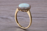Opal and Diamond White Cubic Zirconia set ring, solid 9ct Yellow Gold, very fiery oval cut Cultured Opal
