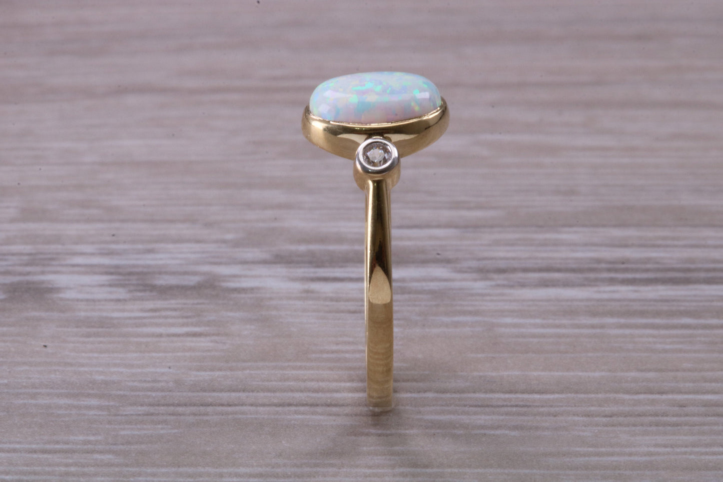 Opal and Diamond White Cubic Zirconia set Trilogy ring, solid 9ct Yellow Gold, very fiery oval cut Cultured Opal