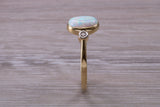 Opal and Diamond White Cubic Zirconia set Trilogy ring, solid 9ct Yellow Gold, very fiery oval cut Cultured Opal