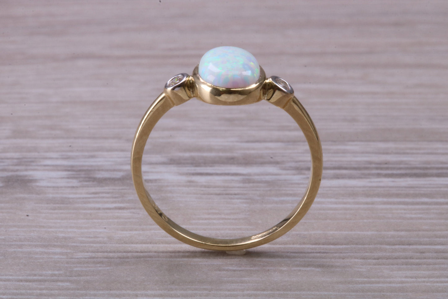 Opal and Diamond White Cubic Zirconia set Trilogy ring, solid 9ct Yellow Gold, very fiery oval cut Cultured Opal