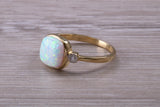 Opal and Diamond White Cubic Zirconia set Trilogy ring, solid 9ct Yellow Gold, very fiery oval cut Cultured Opal