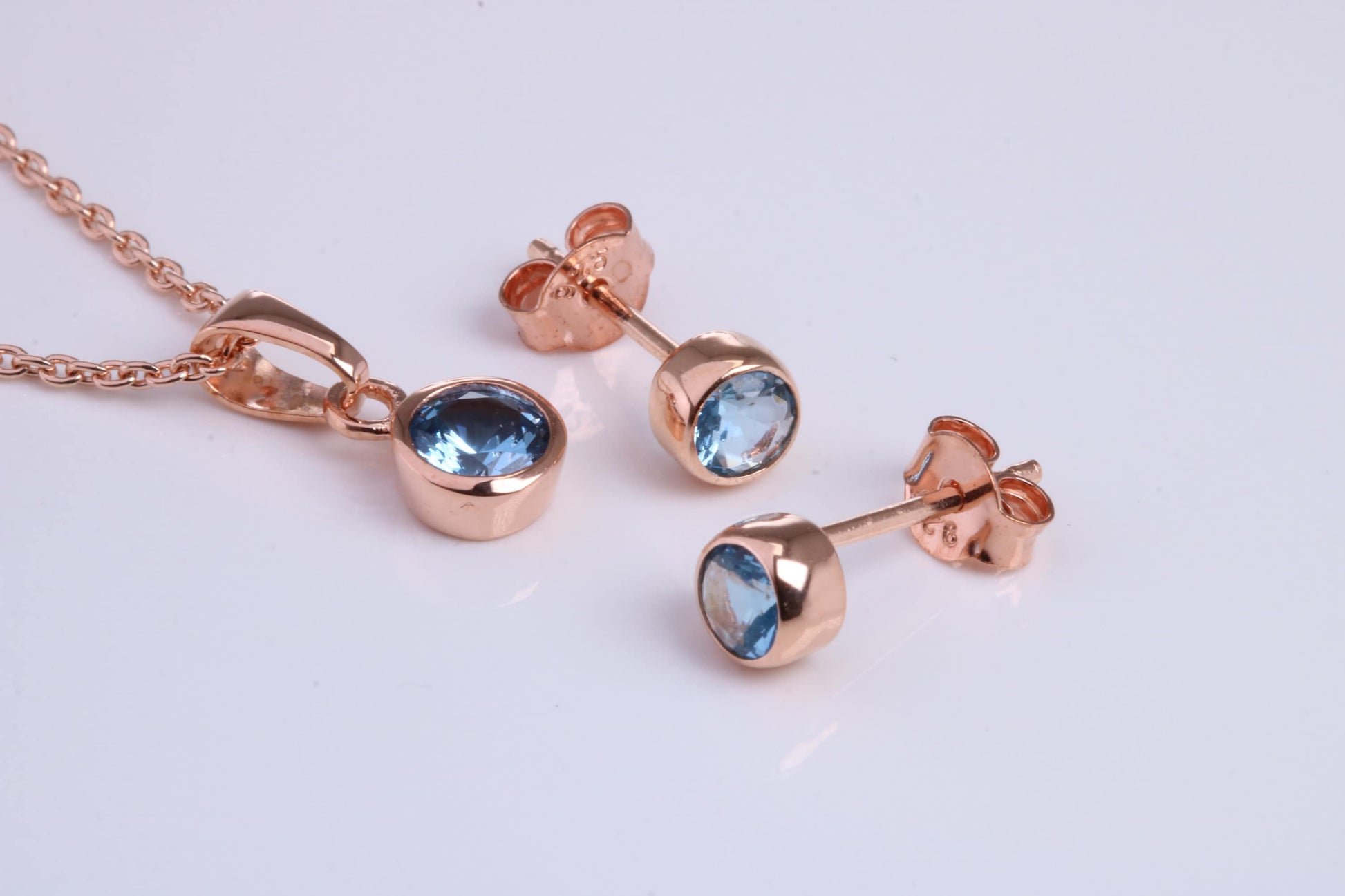 December Blue Zircon C Z set Necklace and Matching Stud Earrings, made from solid Sterling Silver and 18ct Rose Gold Plated