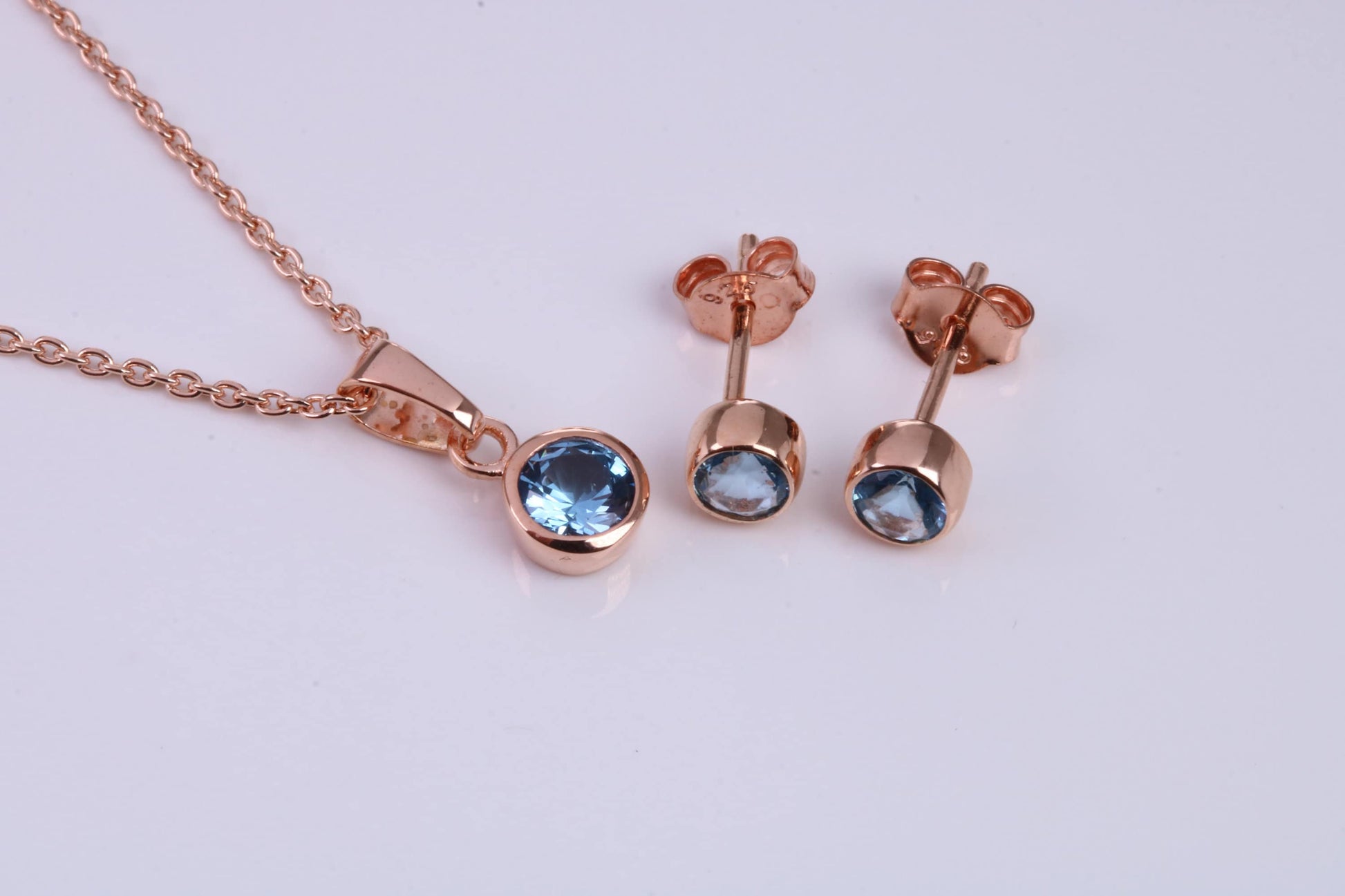 December Blue Zircon C Z set Necklace and Matching Stud Earrings, made from solid Sterling Silver and 18ct Rose Gold Plated