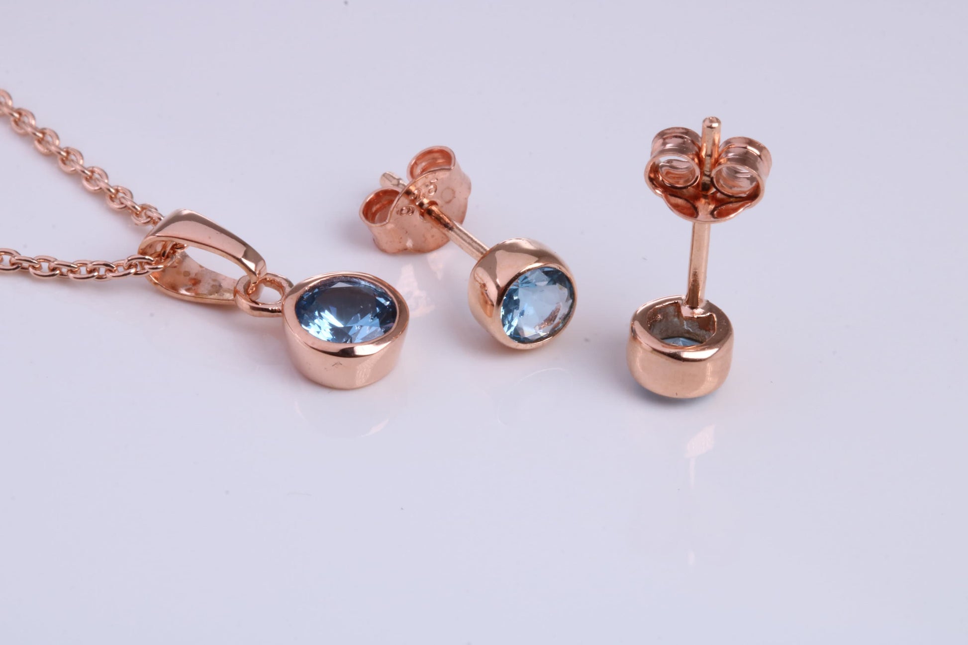 December Blue Zircon C Z set Necklace and Matching Stud Earrings, made from solid Sterling Silver and 18ct Rose Gold Plated