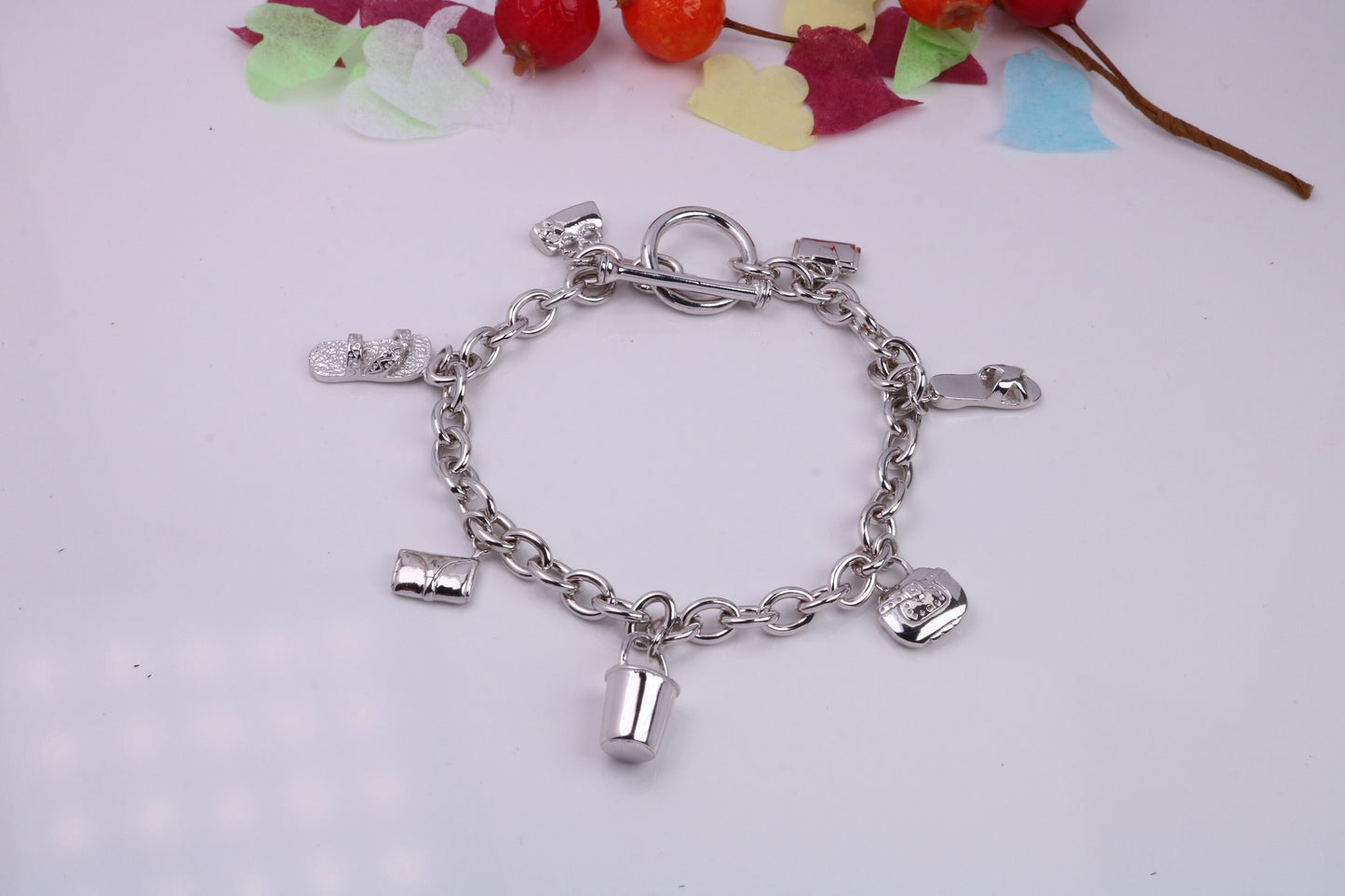 Ready to Wear Charms Bracelet, With Seven C Z set Charms Attached, Made from solid Sterling Silver, 7.50 Inches Long, Good Weighty Feel