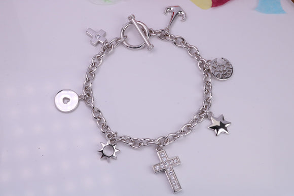 Ready to Wear Charms Bracelet, With Seven C Z set Charms Attached, Made from solid Sterling Silver, 7.50 Inches Long, Good Weighty Feel