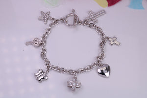 Ready to Wear Charms Bracelet, With seven Charms Attached, Made from solid Sterling Silver, 7.50 Inches Long, Good Weighty Feel