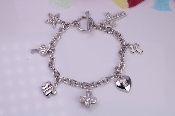 Ready to Wear Charms Bracelet, With seven Charms Attached, Made from solid Sterling Silver, 7.50 Inches Long, Good Weighty Feel